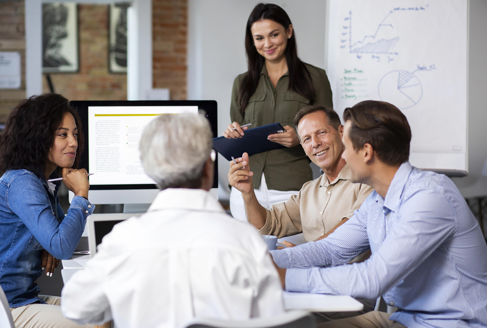 people-using-digital-device-while-meeting